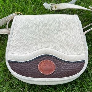 Vintage Dooney & Bourke Teton saddlebag in bone/brown/navy crossbody purse